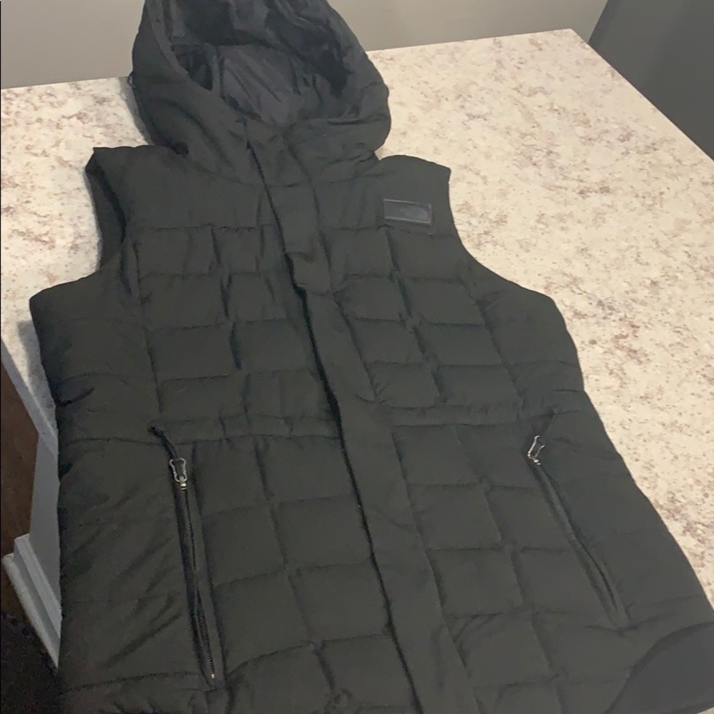 The NorthFace black puffy vest with hood